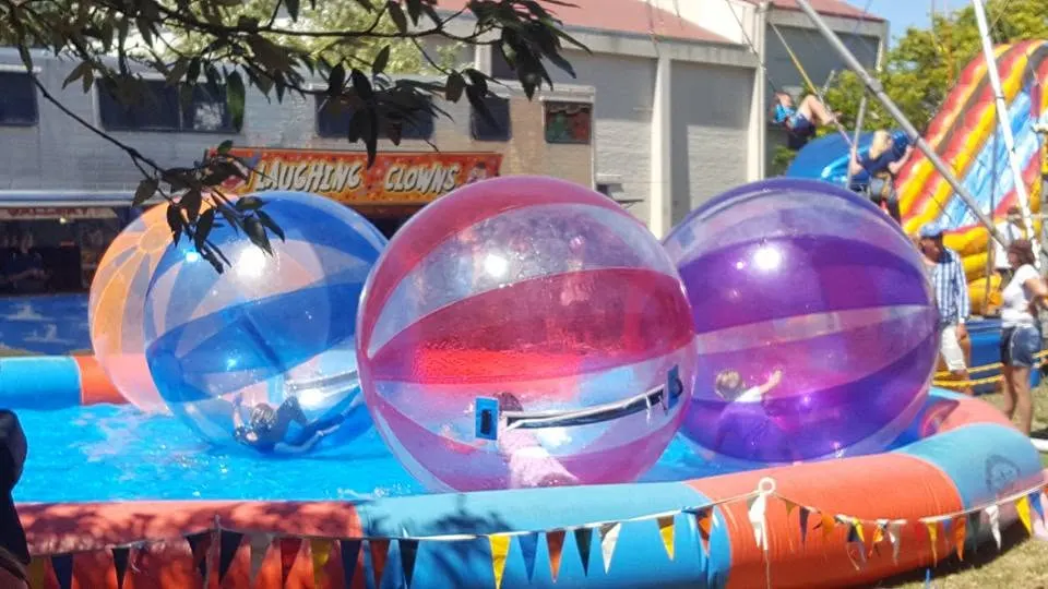 Clear water-walking balls floating in an inflatable pool