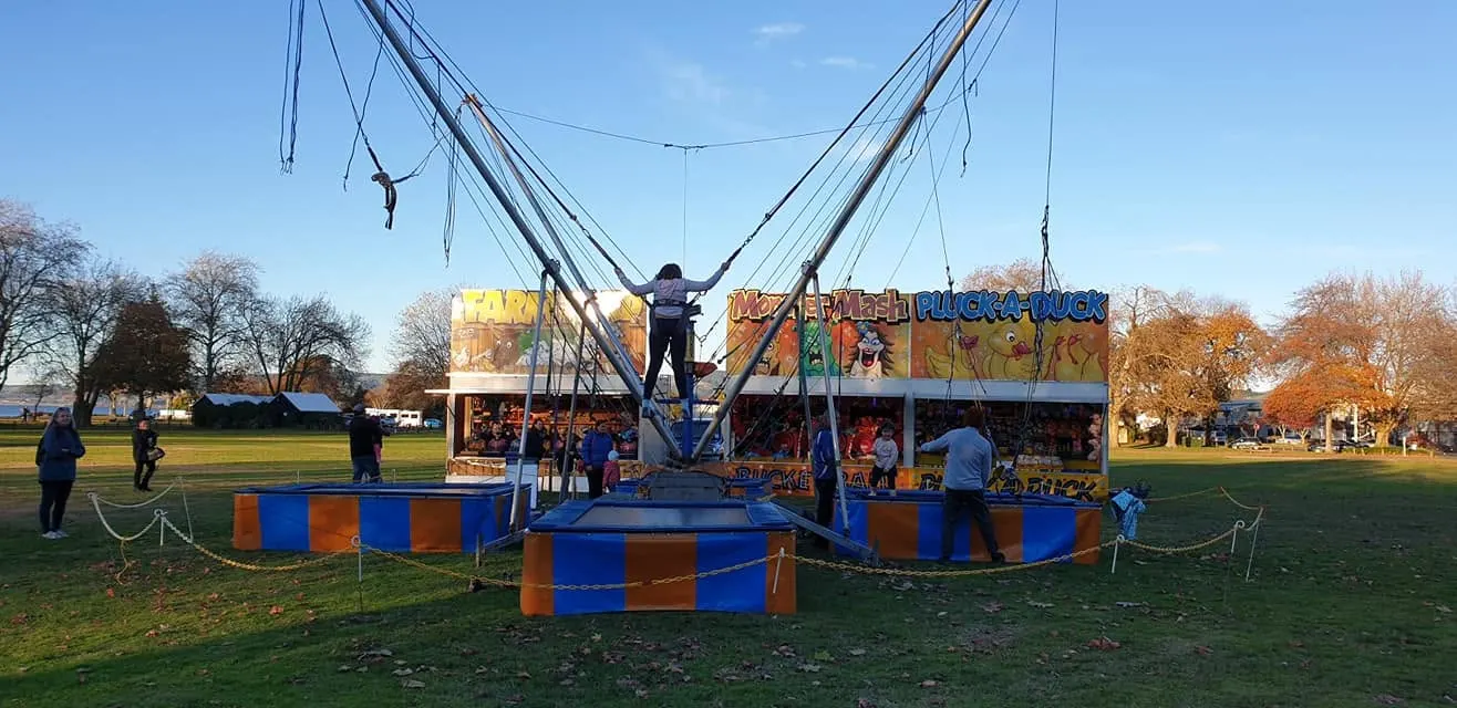 Bungy trampoline in use on a sunny afternoon