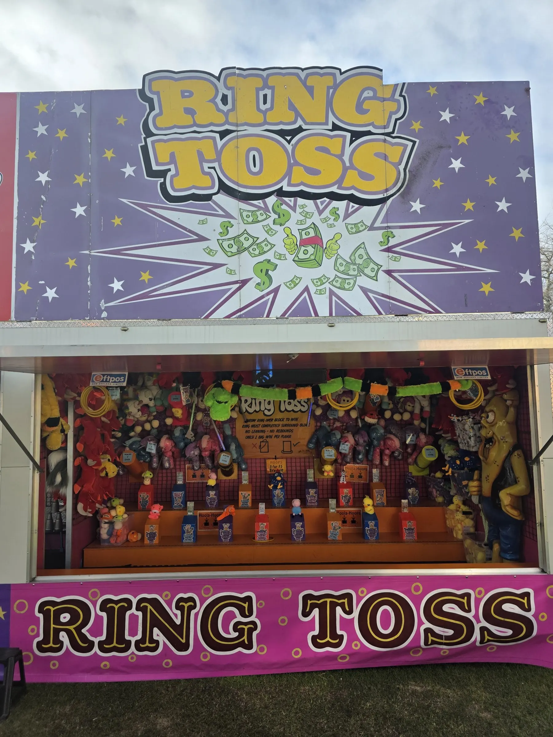 Ring Toss stall with a purple starry sign